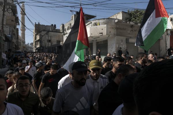 Funeral in West Bank - A hundred men accompany the body of Ibrahim Zayad towards the Qualandya cemetery in West Bak....