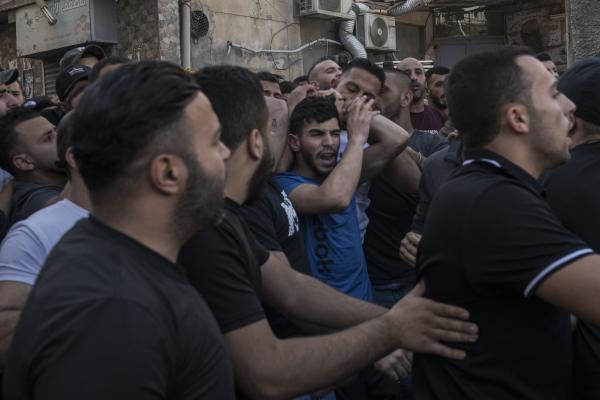 Funeral in West Bank - A group of men carry the body of Ibrahim Zayad towards the Qualandya cemetery in West Bak while...