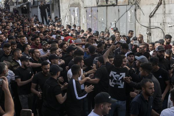 Funeral in West Bank - A crowd carries the lifeless body of 29-year-old Ibrahim Zayad towards the Qualandya cemetery....