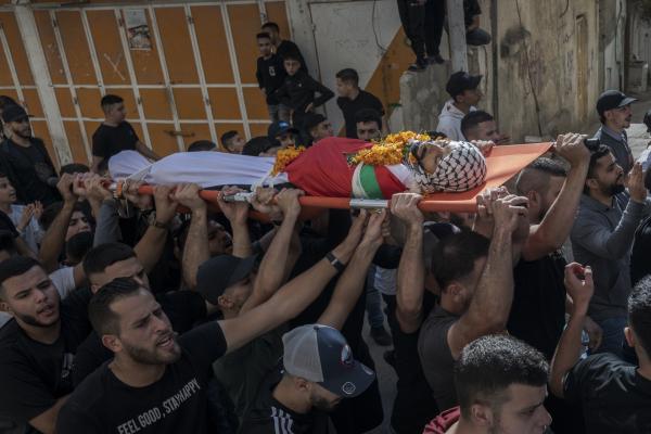 Funeral in West Bank - A large group of men carry the lifeless body of Ibahim Zayad to the Qualandya mosque. Qualandya...