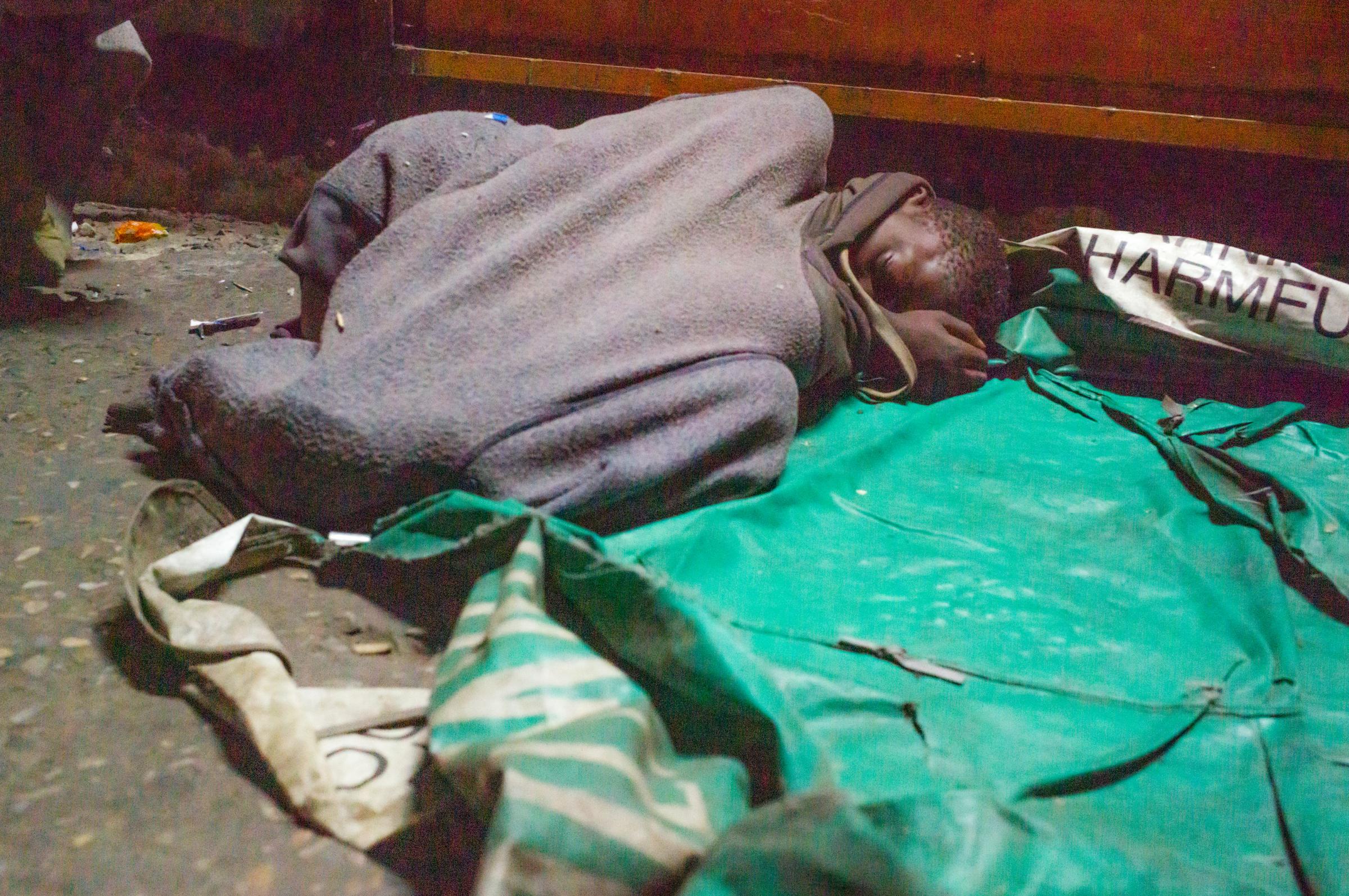 Life on the street in Lusaka - The children sleep huddled together under blankets or cardboard or whatever they can find. It...