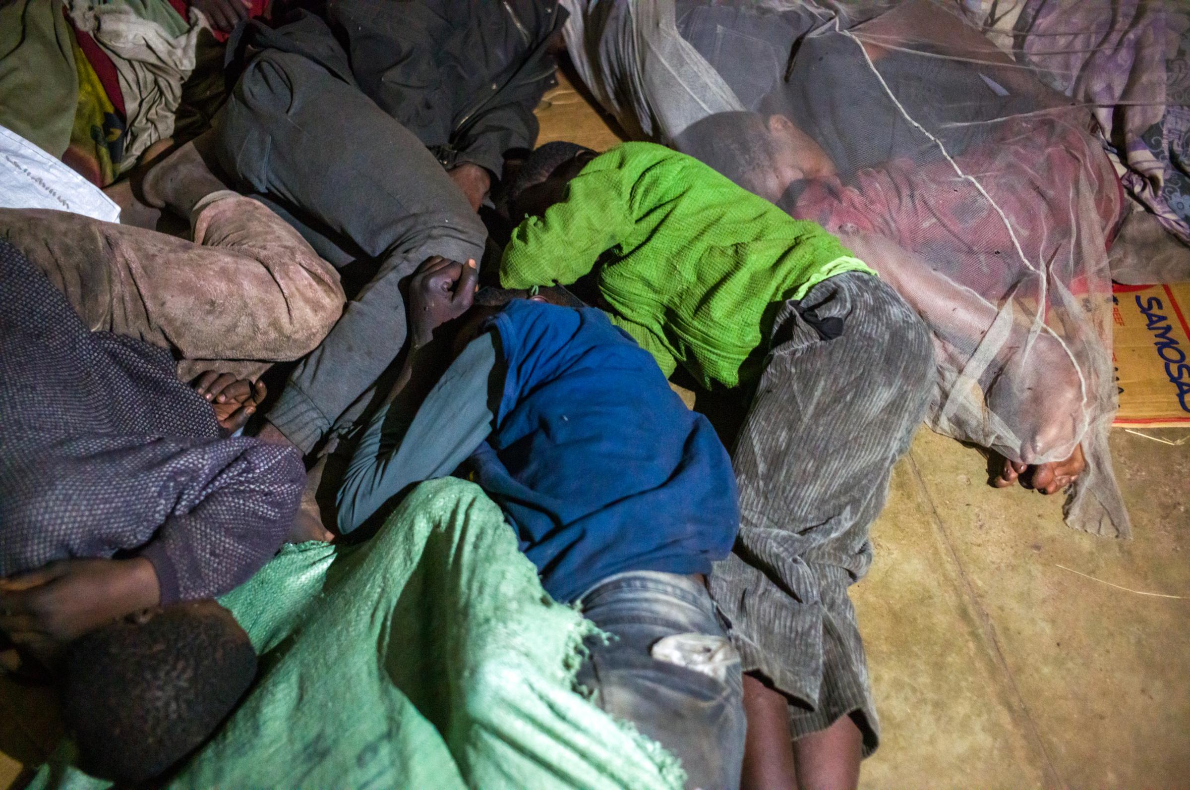 Life on the street in Lusaka - Bodies huddled together under the bridge for comfort and protection. The mosquitoes swarm here at...