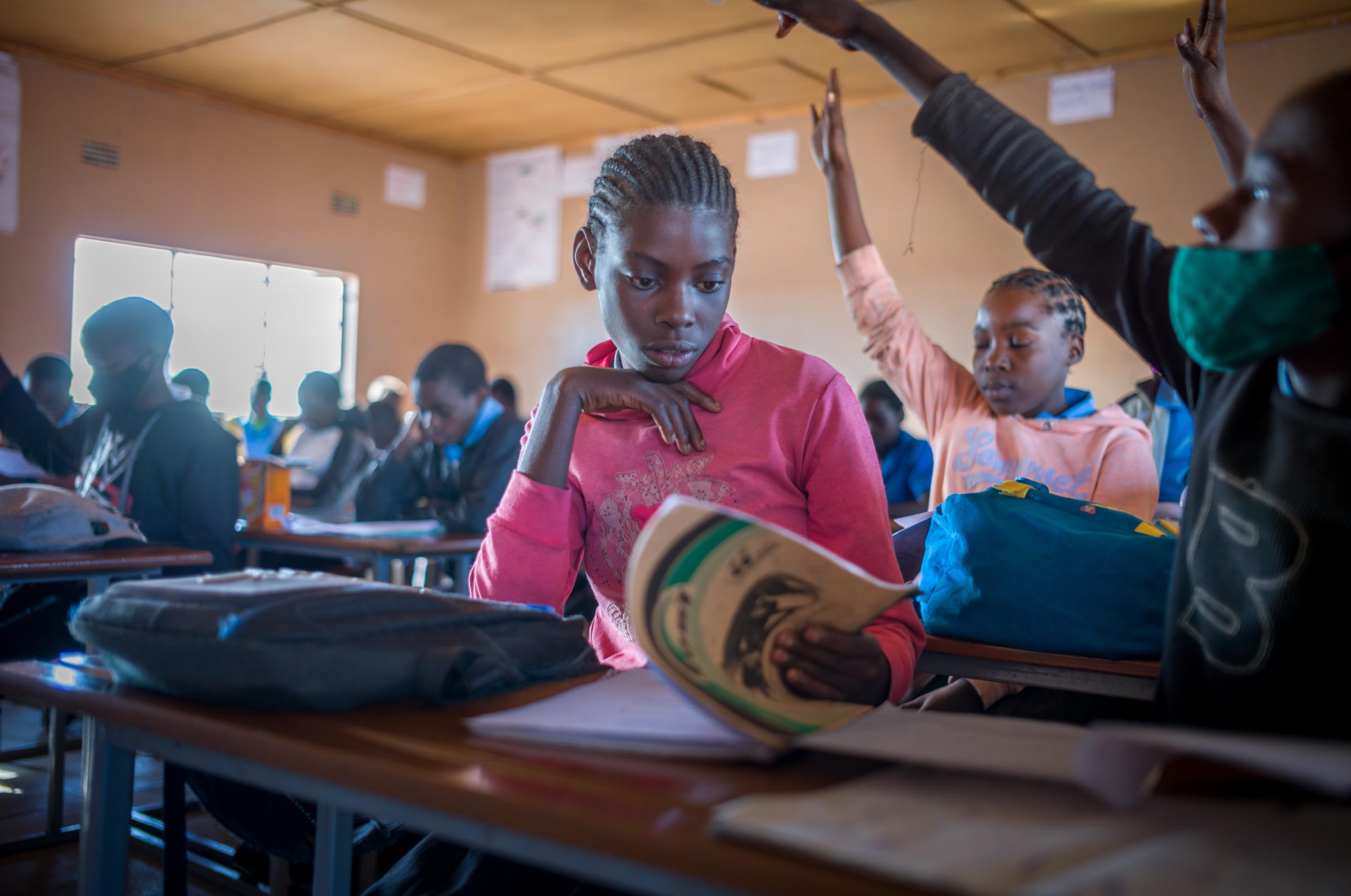 Life on the street in Lusaka - An older girl studies in a classroom which is predominantly filled with &#39;at risk&#39;...