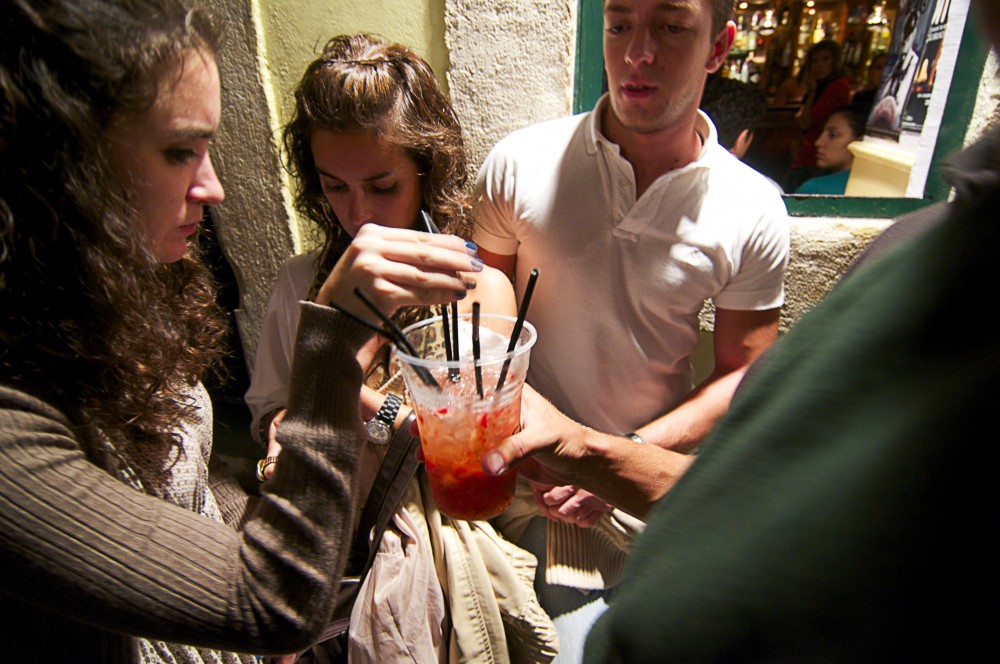 Group of students socializing in Barrio Alto, Lisbon, Portugal.
