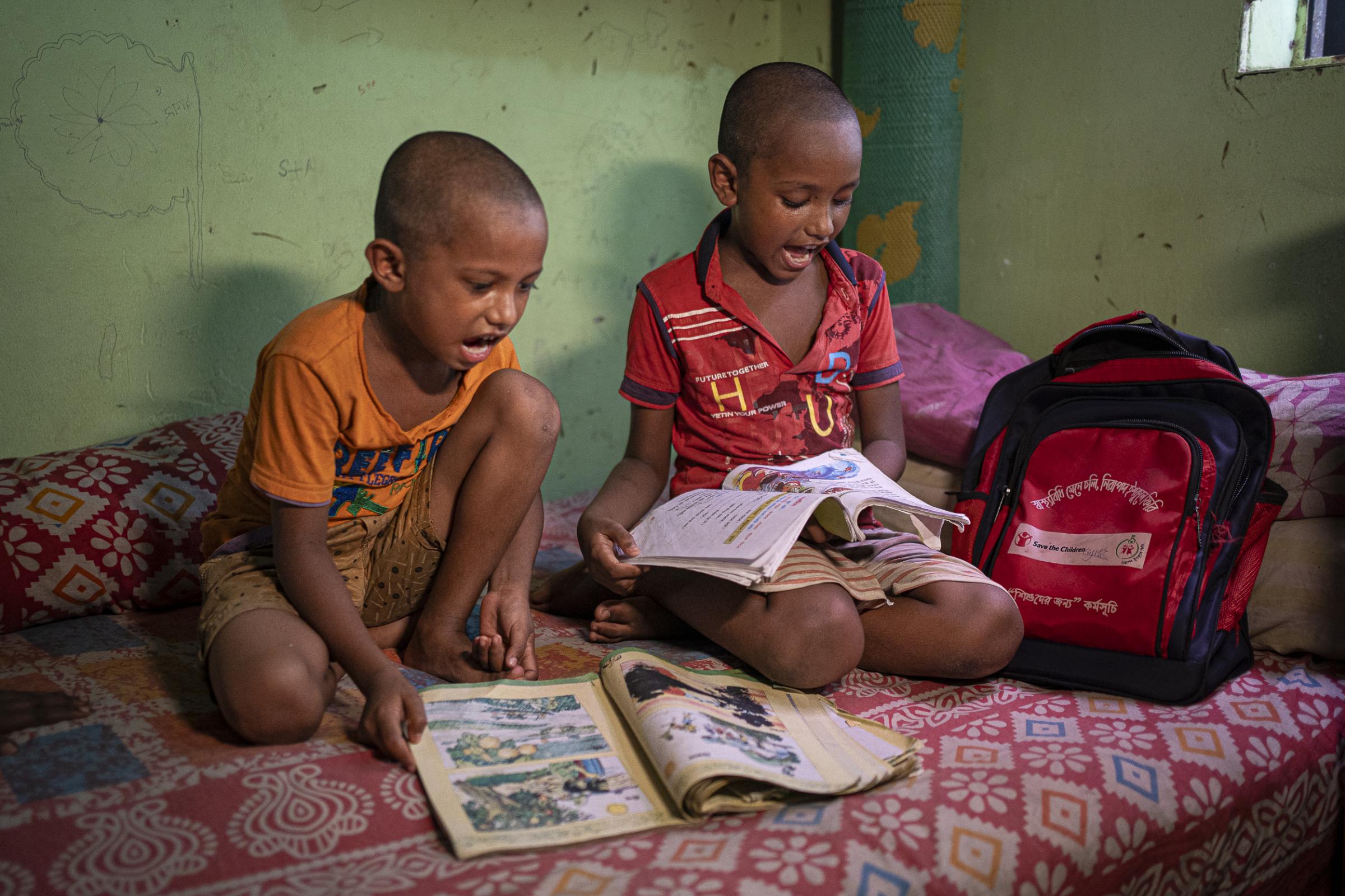 Beyond the storm - Before going to school, Mariam's children finish their...