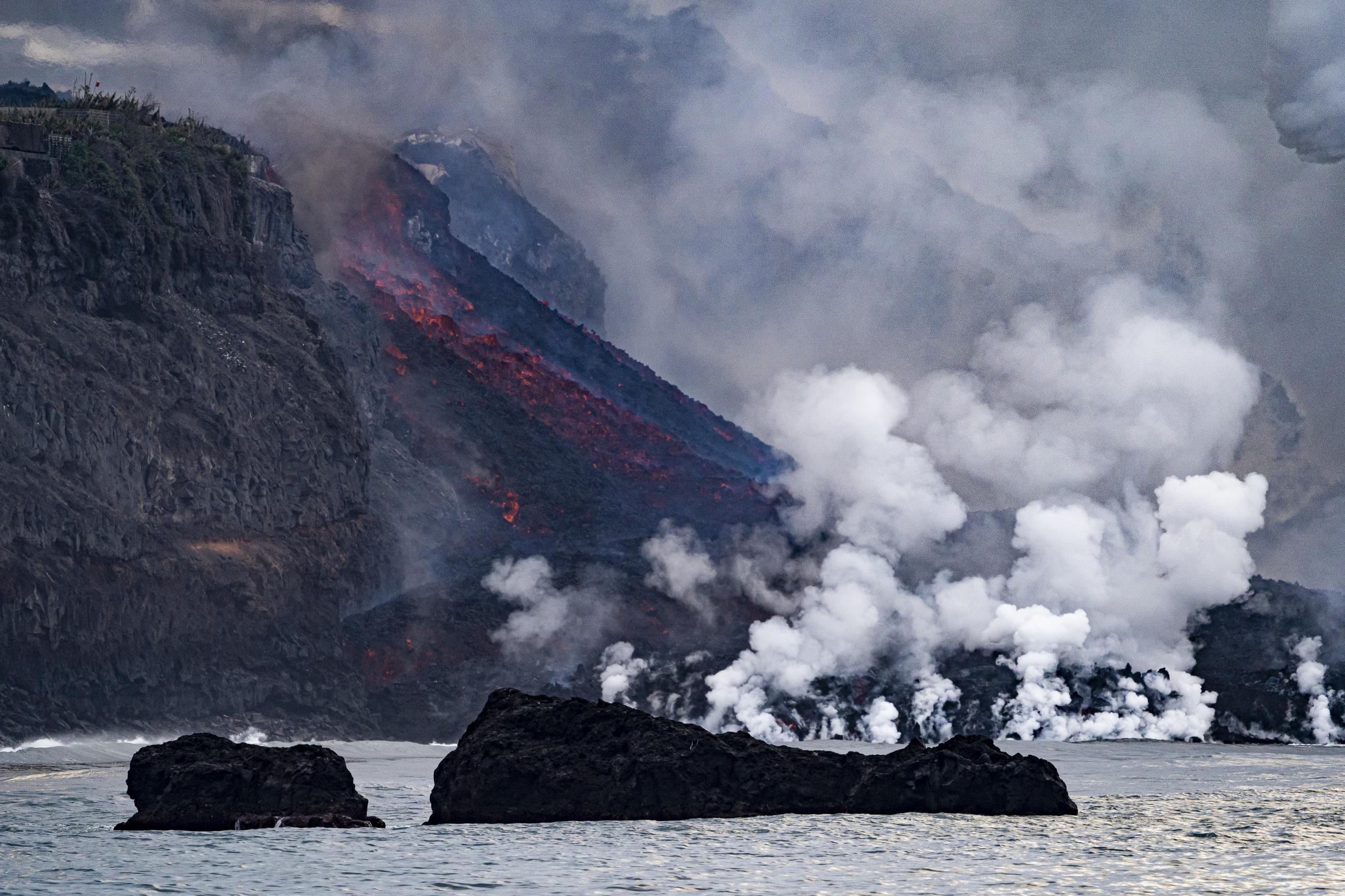 The lava falls into the sea at the coast of Tazacorte. This is the second faja formed on the...