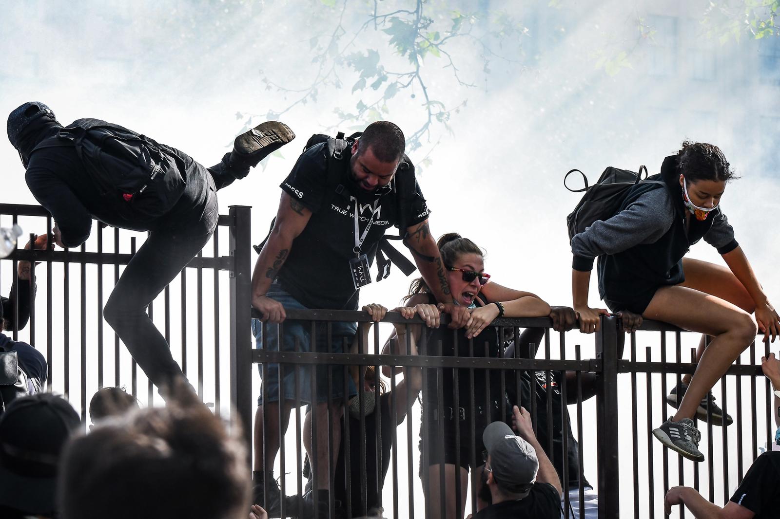 Demonstrators climb over a fenc...ladelphia, Pa. on June 1, 2020.