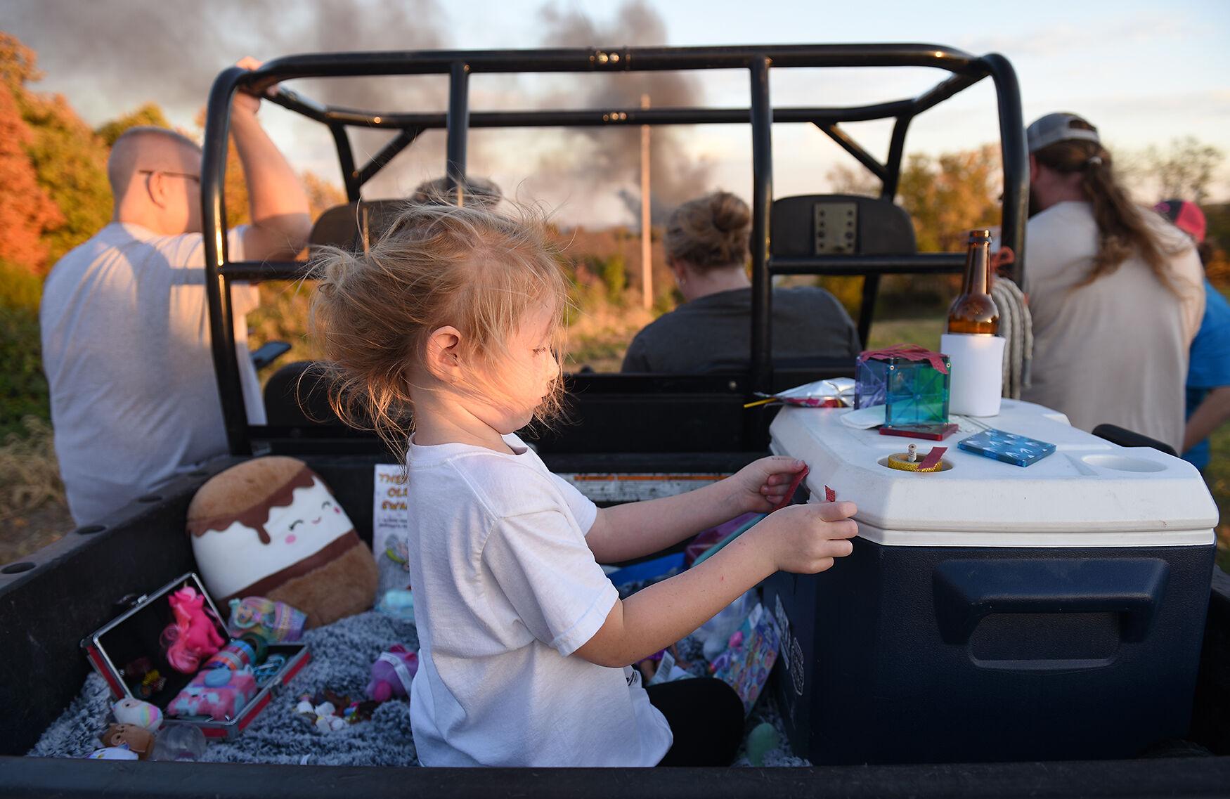 Wooldridge Fire - Della Miller, 6, plays with her toys Saturday, Oct. 22,...