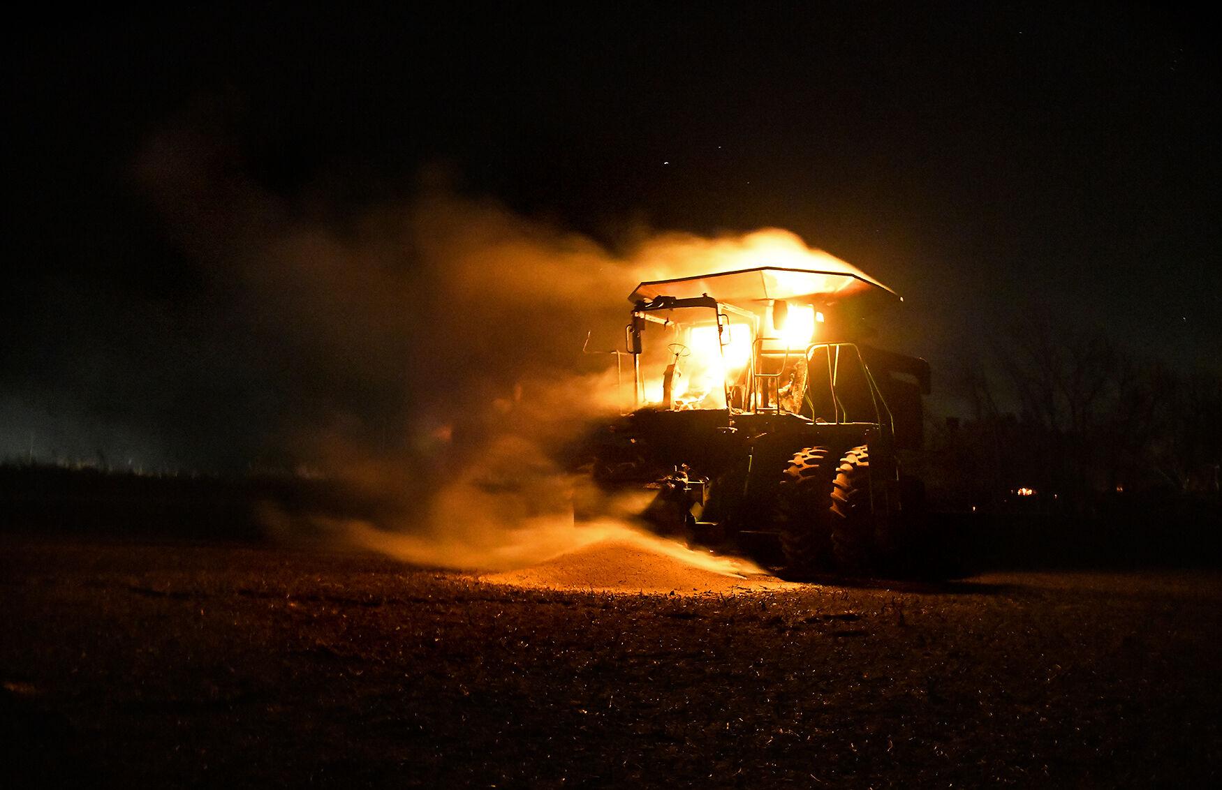 Wooldridge Fire - A John Deere combine sits ablaze in a field on Saturday...
