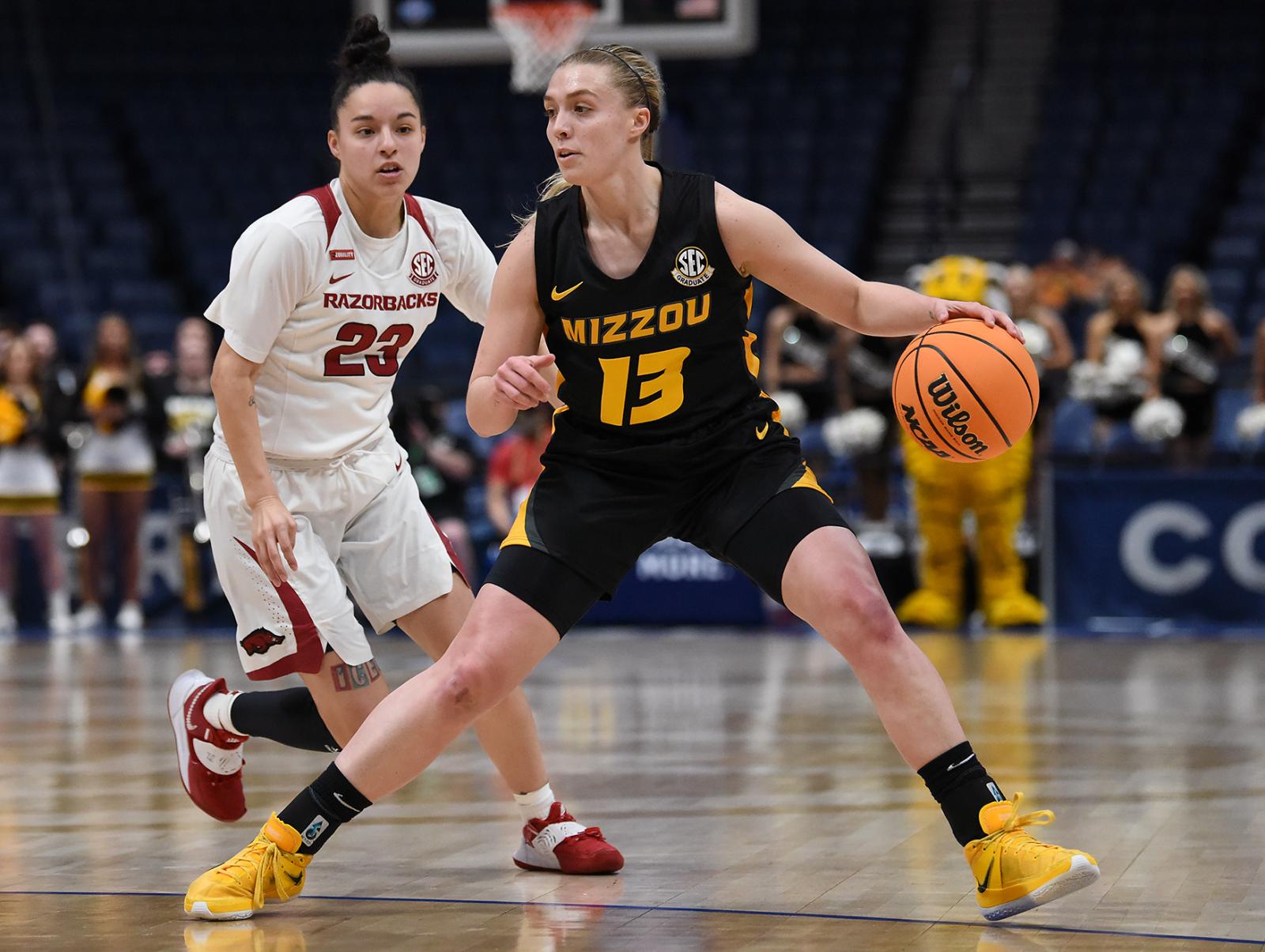 Image from Singles - Haley Troup dribbles the ball on Thursday, March 3, 2022...