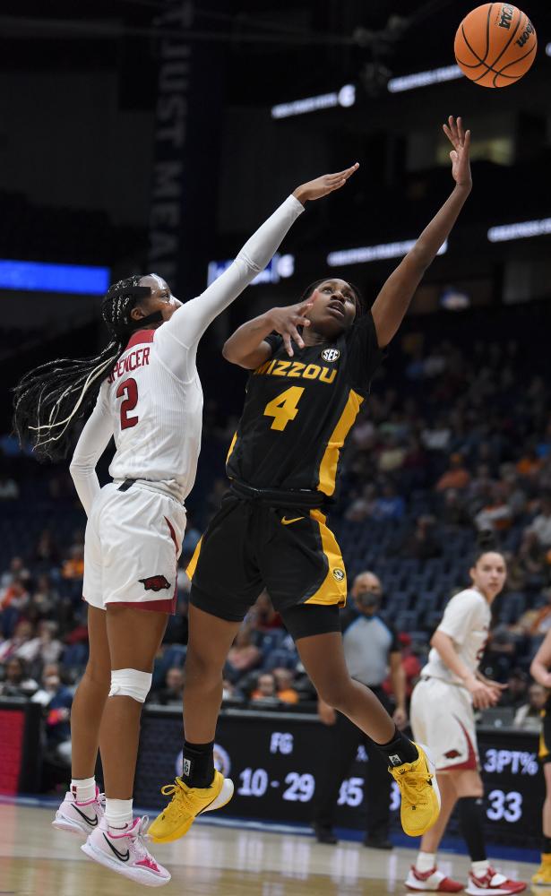 Missouri&rsquo;s Mama Dembele, right, goes up for a shot against Arkansas&rsquo; Samara Spencer on Thursday, March 3, 2022 at Bridgestone Arena in Nashville. Dembele scored two points and one rebound during the game against Arkansas.