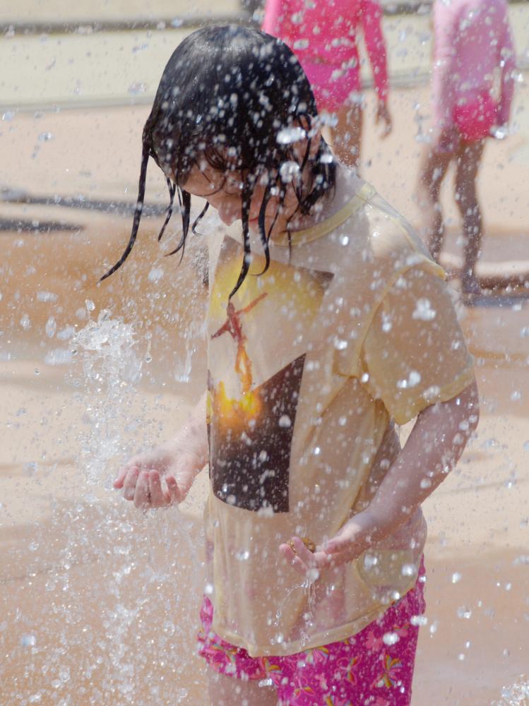 Claudia Young, 8, plays in the water on Friday, June 18, 2021 at Stephens Lake Park in Columbia. Claudia played in the water with her twin sister, Elise, and many other kids. 