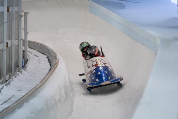Image from Sports - Bobsled team finishes strong in their run in the Junior...