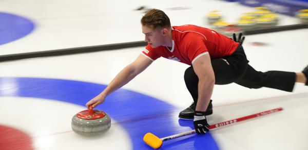Image from Sports - Andreas Gerlach of Team Switzerland delivering the stone...