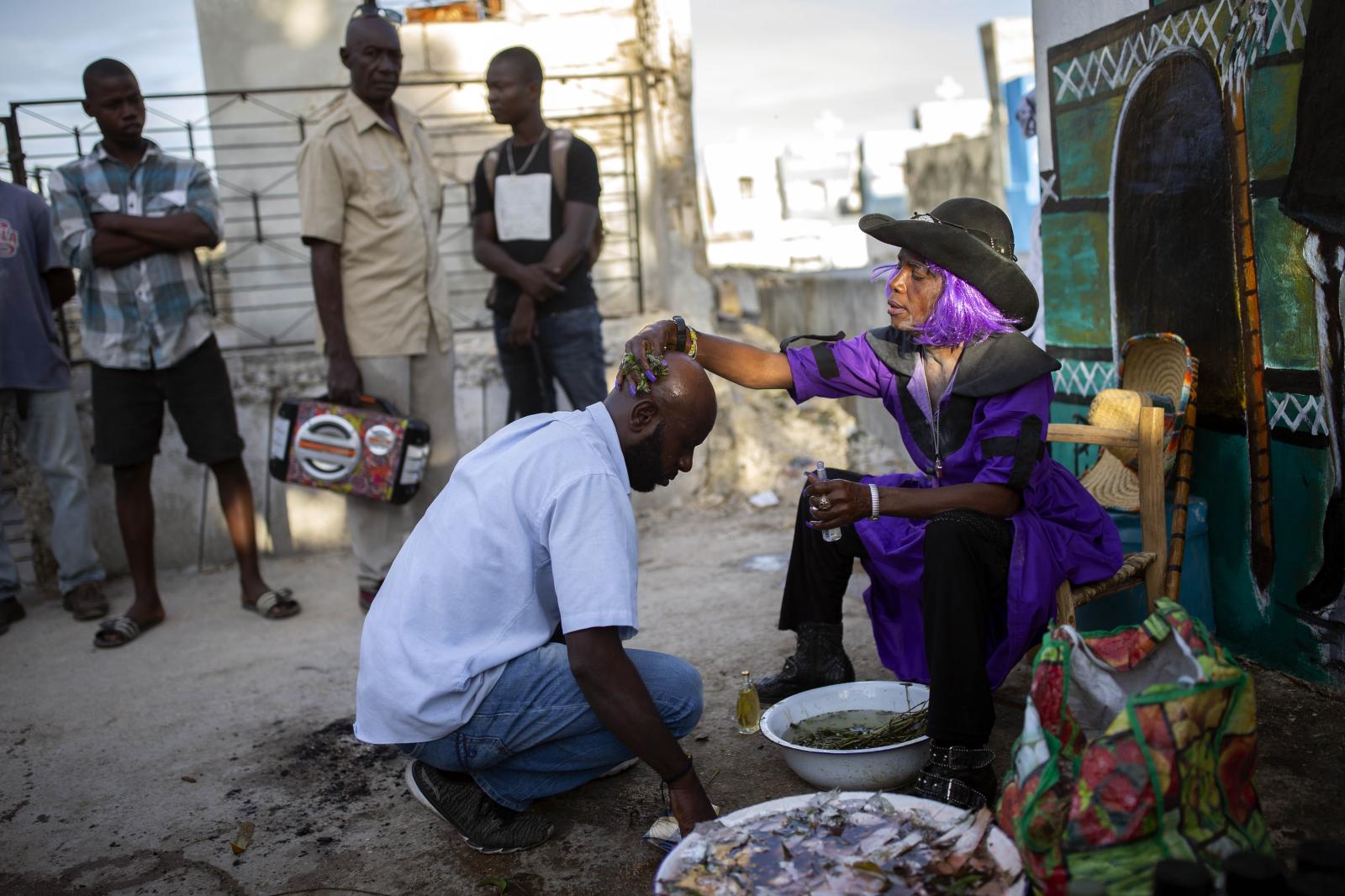 A Vodou priestess removes bad l...Nalio Chery) Port-au-Prince HTI