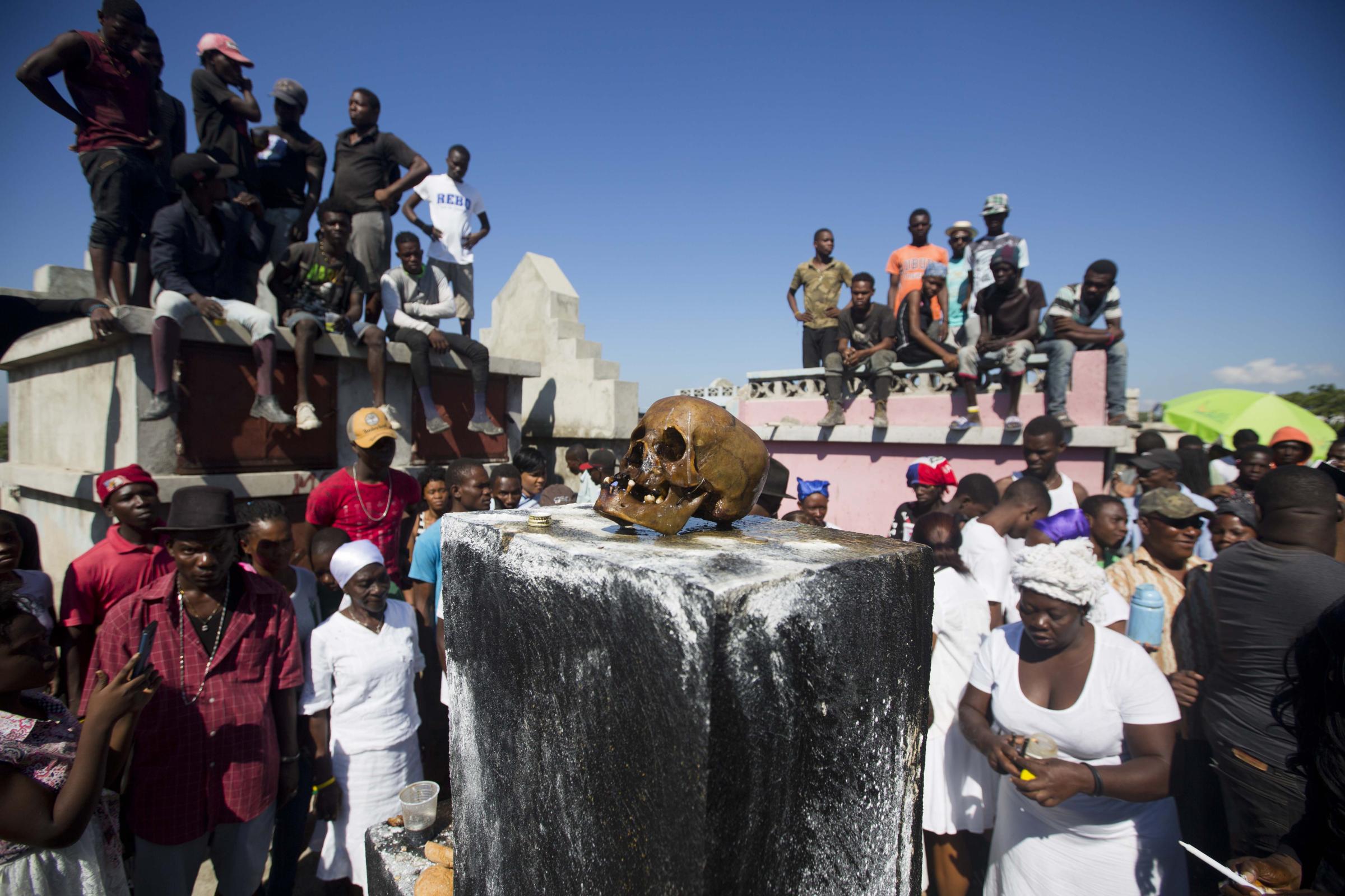 Vodou in Haiti - In this Nov. 1, 2018 photo, a human skull sits on top of...