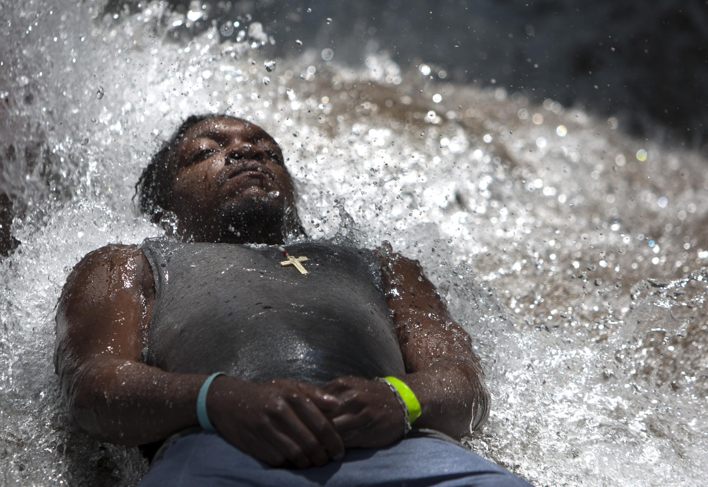 Vodou in Haiti - In this picture taken July 14, 2012. a Pilgrim bathes in...