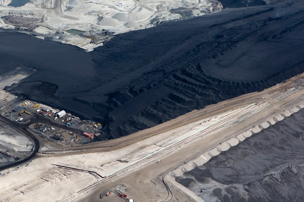 Black Gold, Dead Earth - Mountains of Petcoke at the Suncor Oil Sands Development...