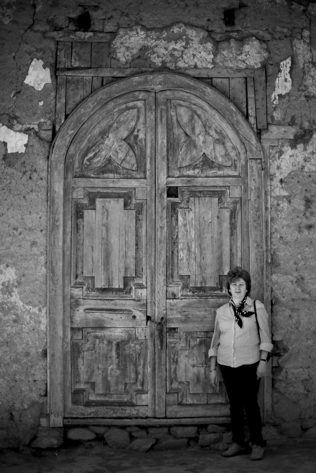 The silent and lonely death in the avocado valley - A woman poses in the ruins of an old church that has been...