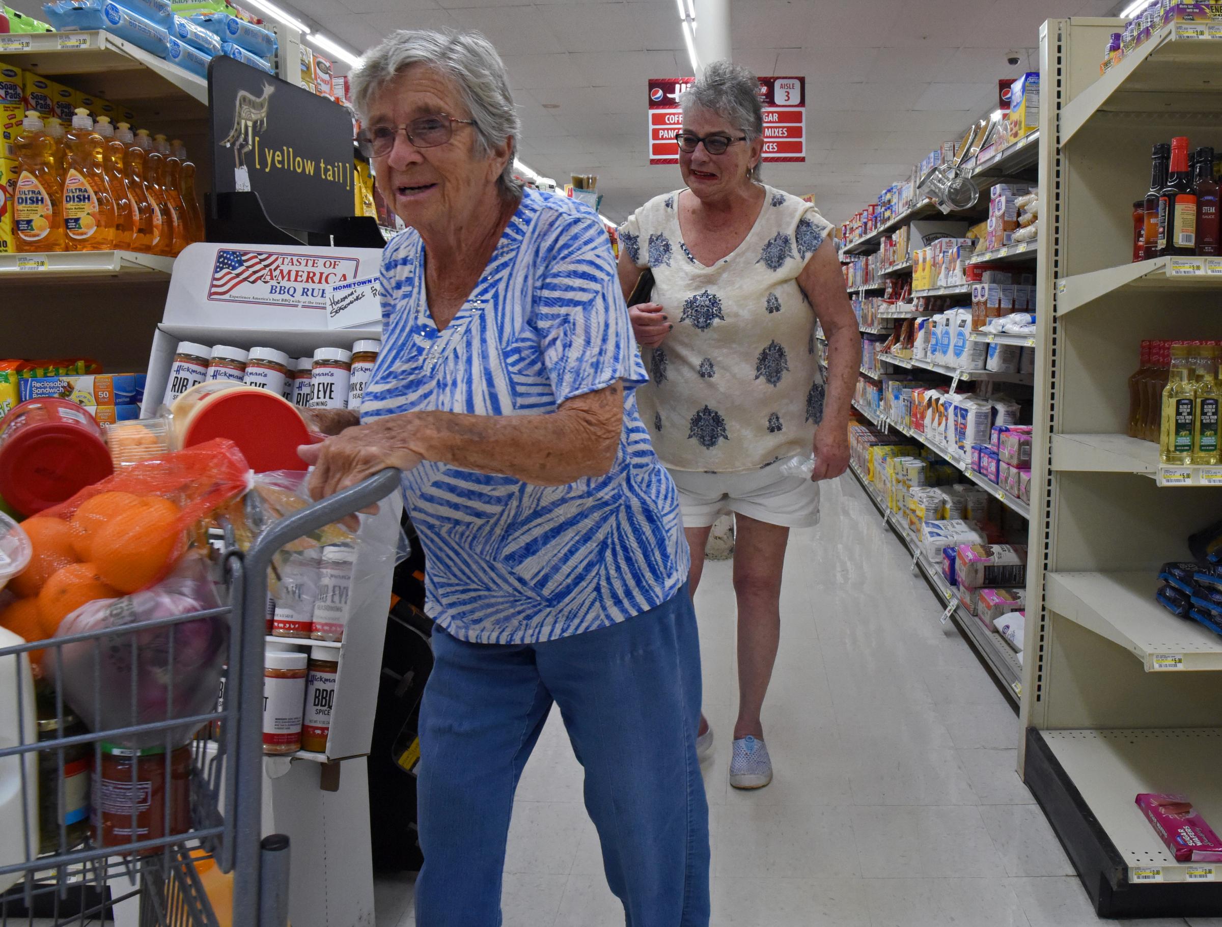 Hickman IGA: Serving community since 1959 - Mother and daughter, Jo Hoyt, left, and Rhonda Long shop...