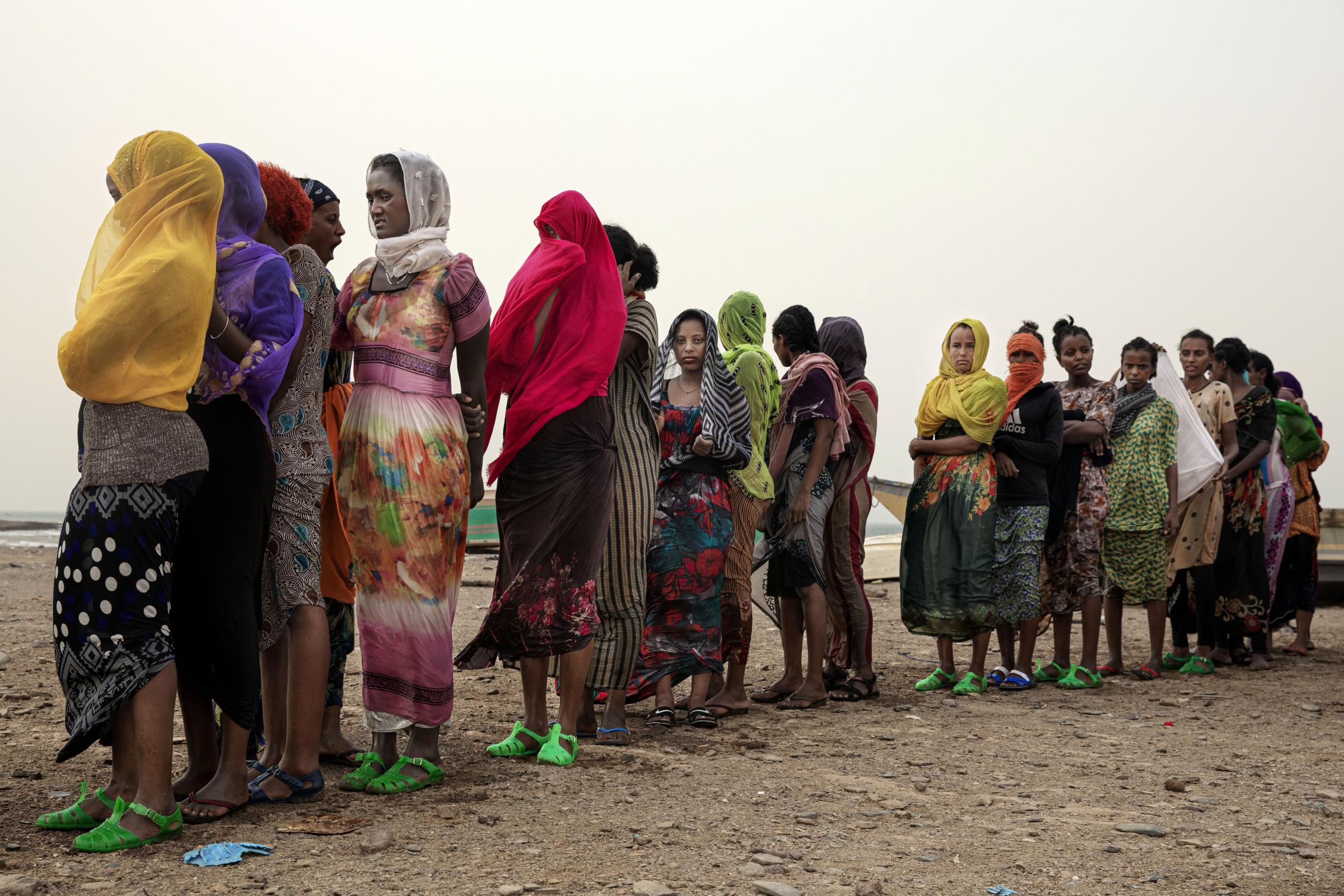  Ethiopian Tigray women stand in line as they are counted by smugglers after arriving to the coastal village of Ras al-Ara from Djibouti, in Lahj, Yemen. Girls as young as 13. They endure hunger and exhaustion walking through deserts, the dangers of a sea crossing and, often, rape and torture at the hands of traffickers. Still, they are fearless and determined to reach the oil-rich kingdom and work as maids and domestic servants in Saudi Arabia&rsquo;s lavish households. 