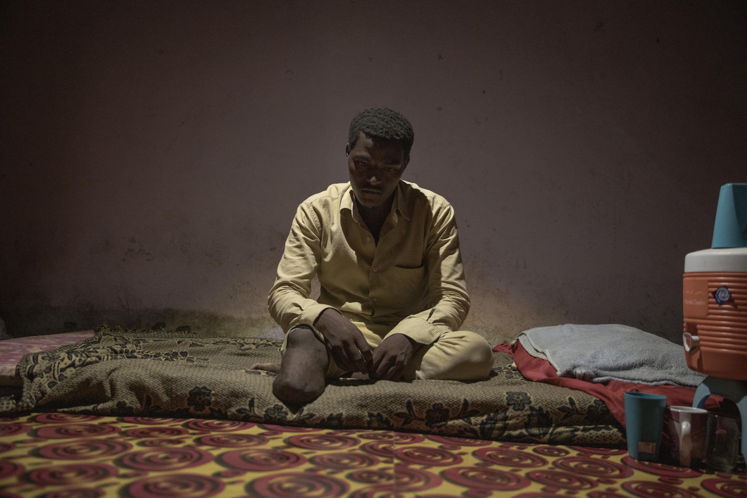  Abdul-Rahman Taha, 17, shows his amputated leg, at his home, in Basateen, a district of Aden, Yemen. When he landed at Ras al-Ara, traffickers took him and 50 other migrants to a holding cell, demanding phone numbers. Taha couldn&#39;t ask his father for more money so he told them he didn&#39;t have a phone number. One night, a captor beat his right leg with a steel rod. Taha passed out and was dumped in the desert with three dead migrants by traffickers. 