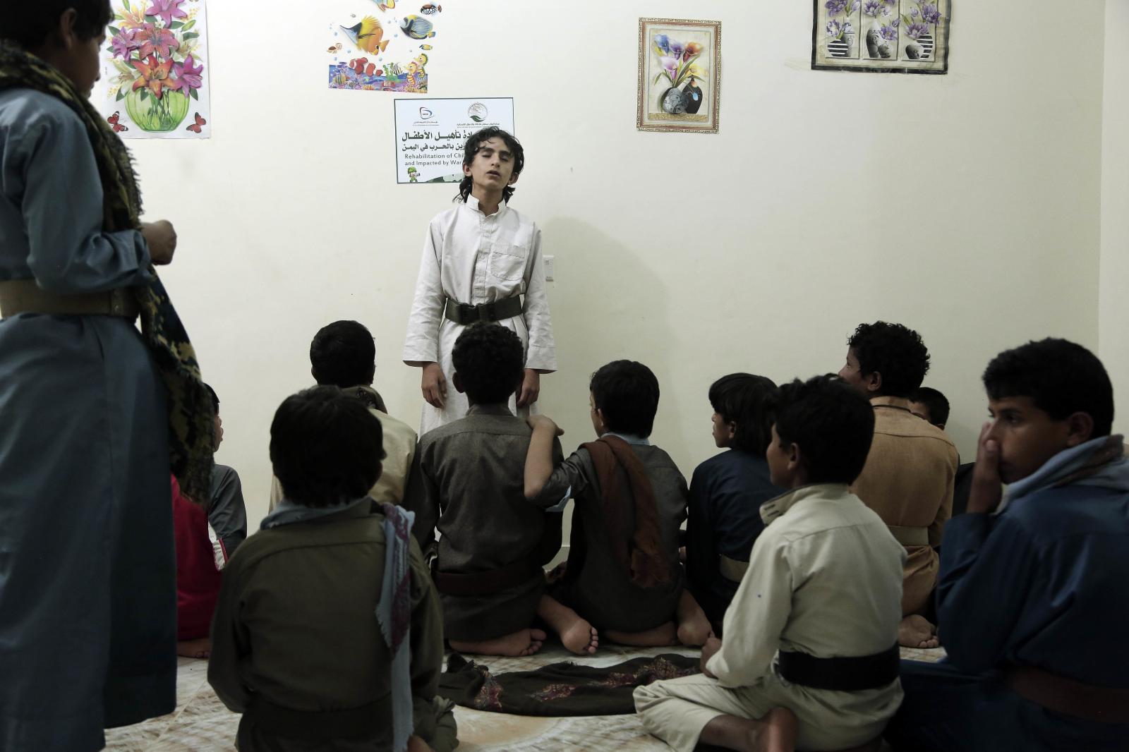 Boys recite poems at the rehabi...former child soldiers in Marib.