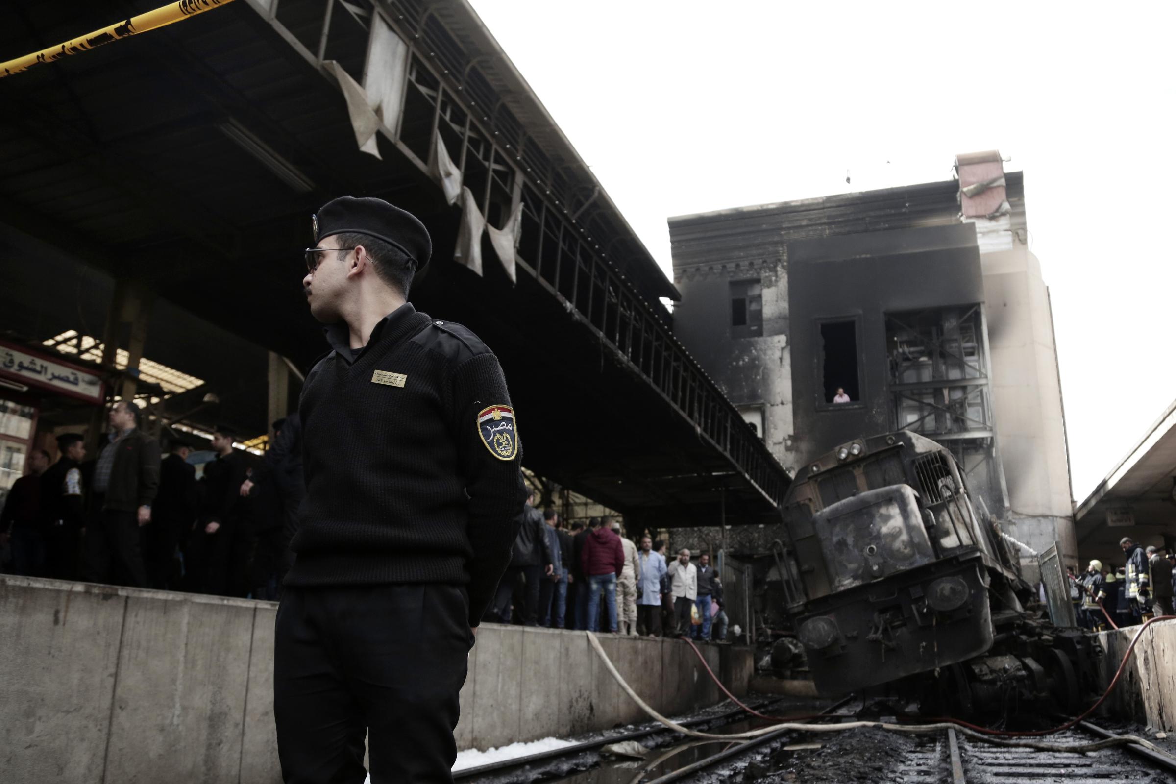 Fiery Crash at Cairo Train Station -  Policemen inside Ramsis train station in Cairo. 