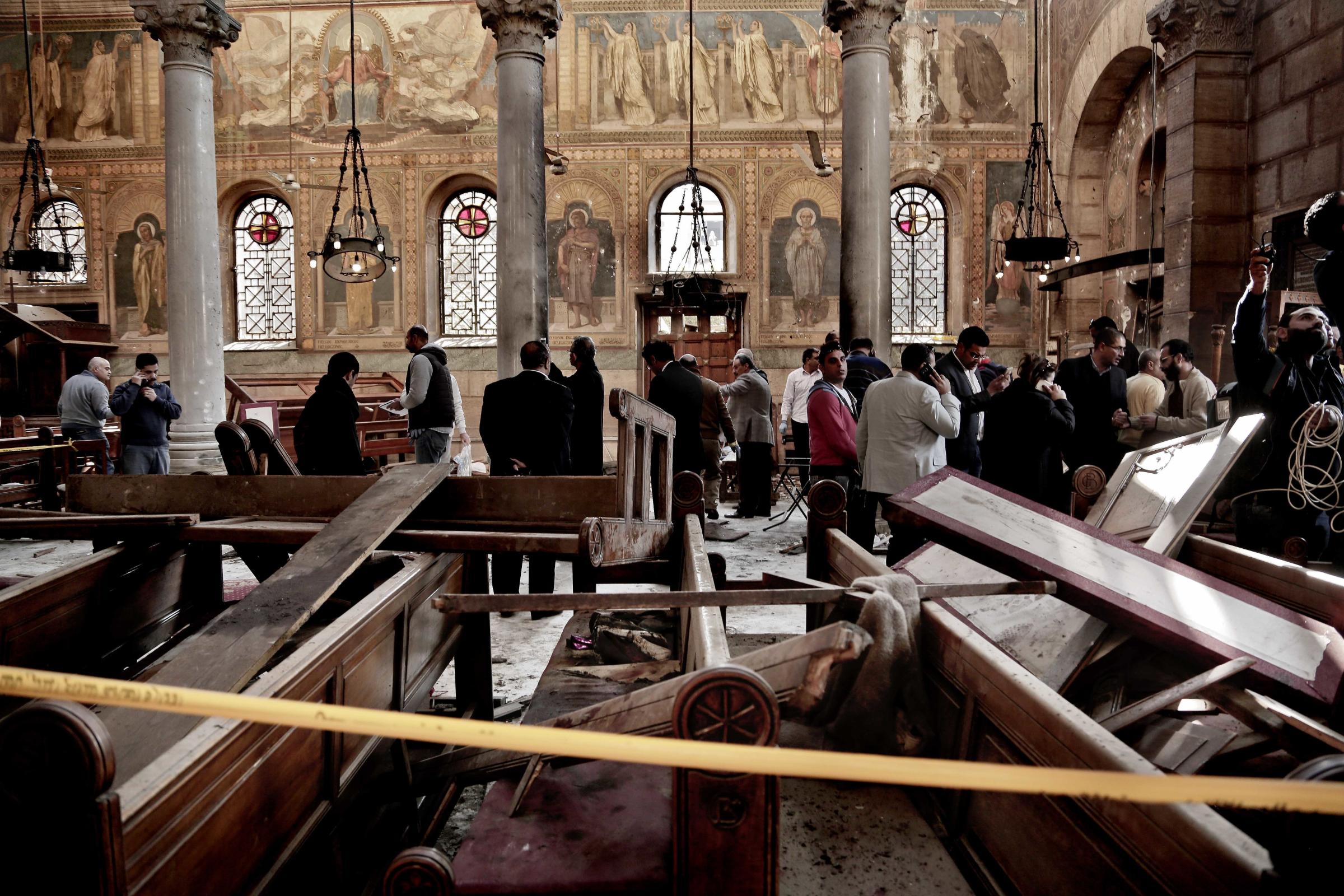 Egypt's main Coptic Christian cathedral attack -  Security forces examine the scene inside the St. Mark...