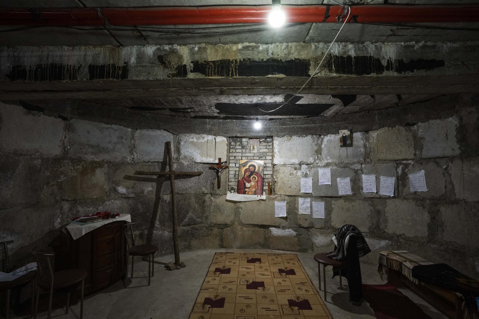 A makeshift chapel in the bomb ...he cavernous underground space.