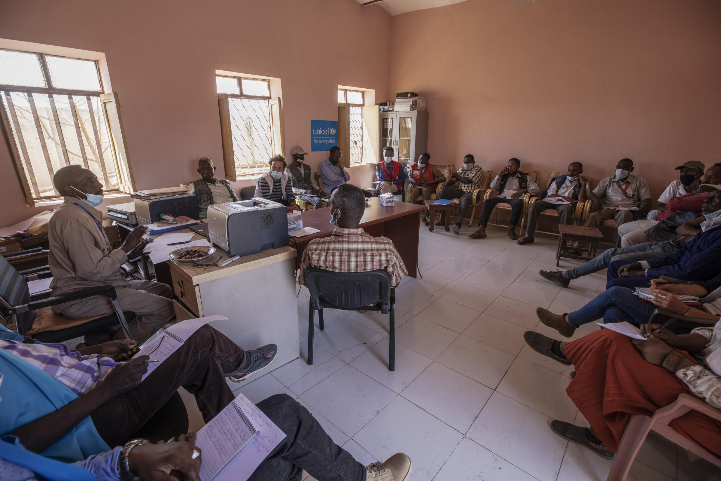 Dr. Tewodros Tefera attends a weekly meeting with all non-governmental organization (NGO) representatives focusing on Tigrayan refugees, inside the Hamdayet Transition Center.