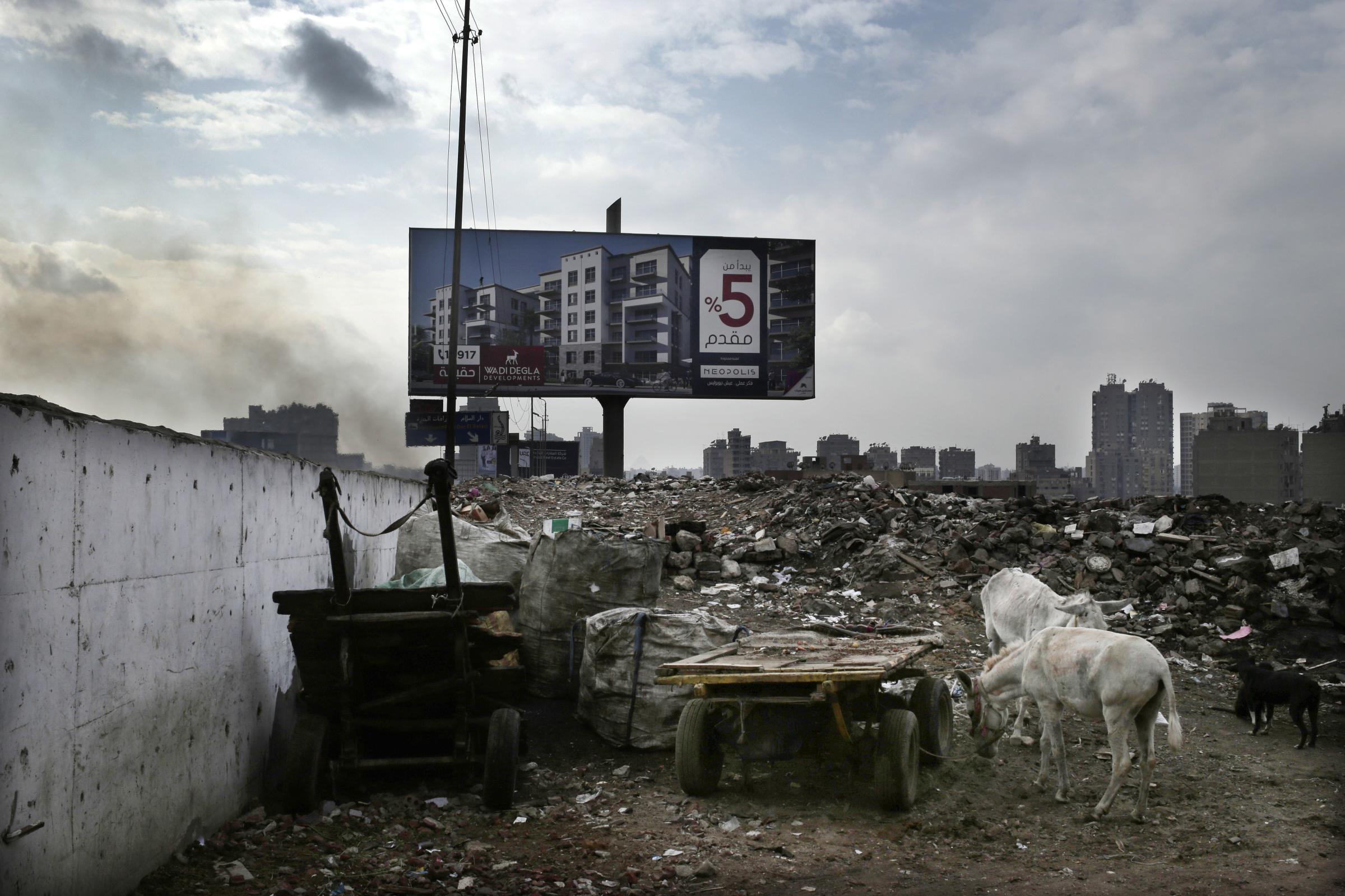 Cairo's demolitions campaign -   An advertisement for a residential housing compound in...