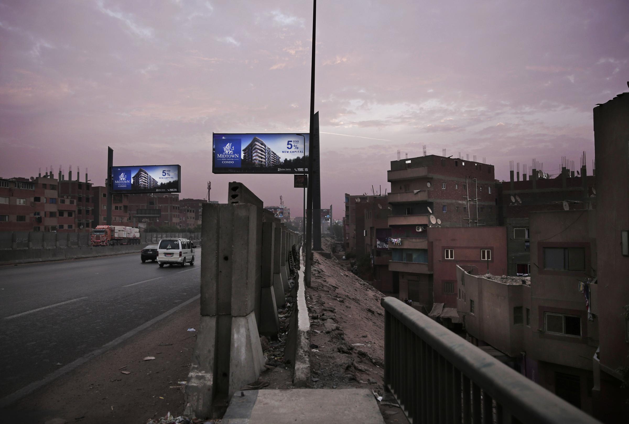 Cairo's demolitions campaign -   Billboards promoting a new residential housing compound...