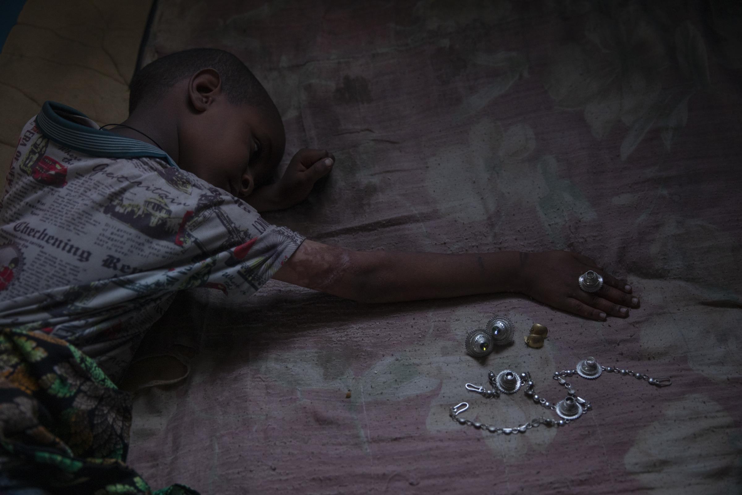 Tigray babies born in bloodshed  -  Micheale wears his deceased mother's jewelry. 