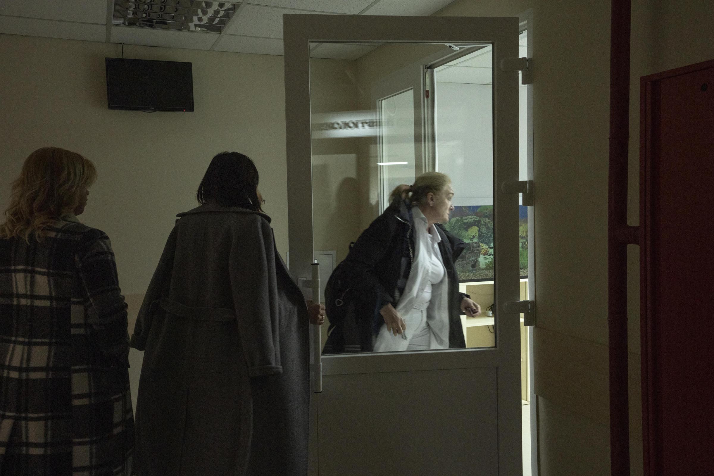 Ukraine Wartime Births -  Women rush to the bomb shelter as the air sirens go off,...