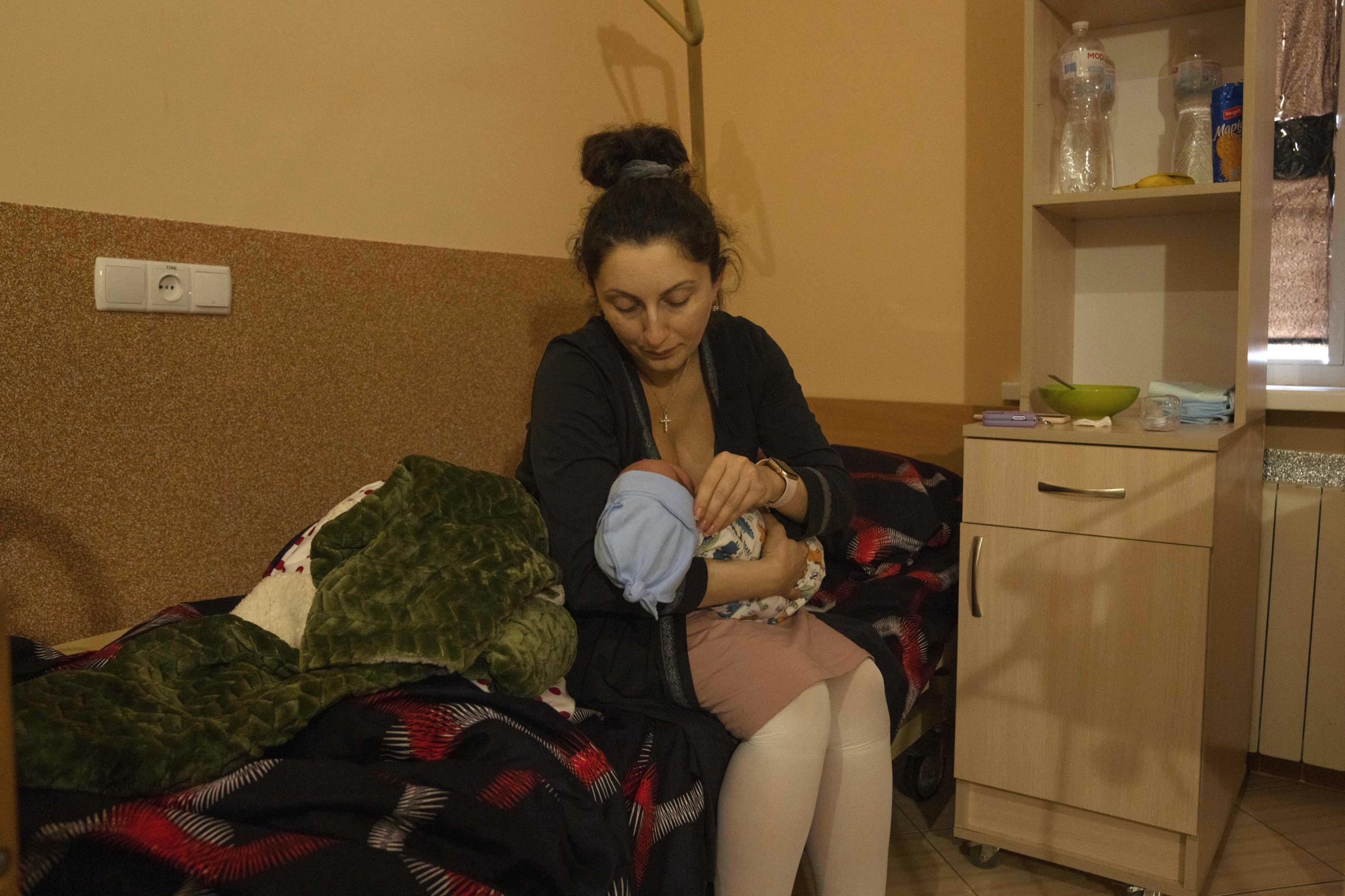  Hanna Chuklin, 38-year-old lawyer displaced from Kyiv, breastfeeds her one-day-old son Mykhailo. 