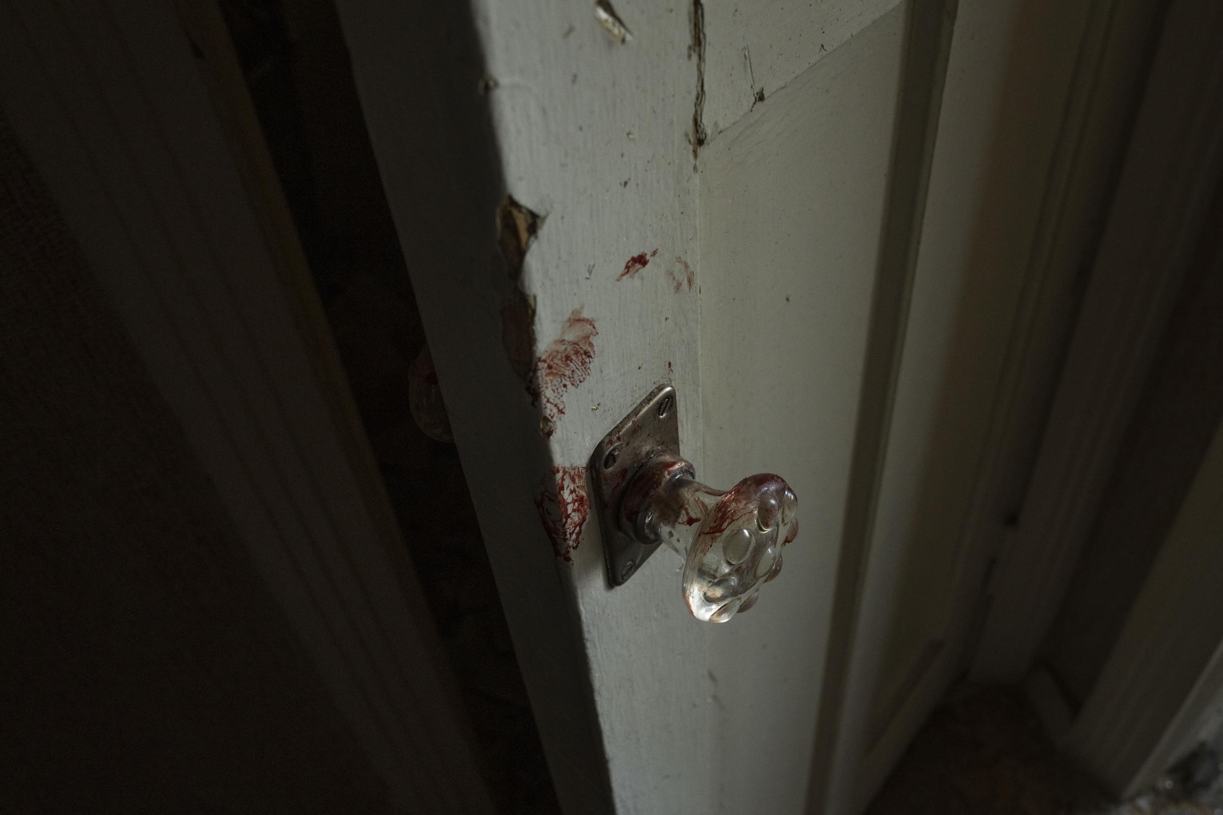 Missile strike hits eastern Ukraine's Kramatorsk -  Blood stains on a door in the hallway of the apartment...