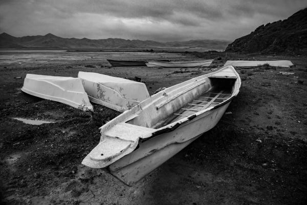 Landscape - Boats sitting on the salt of Lake Urmia. In the past,...