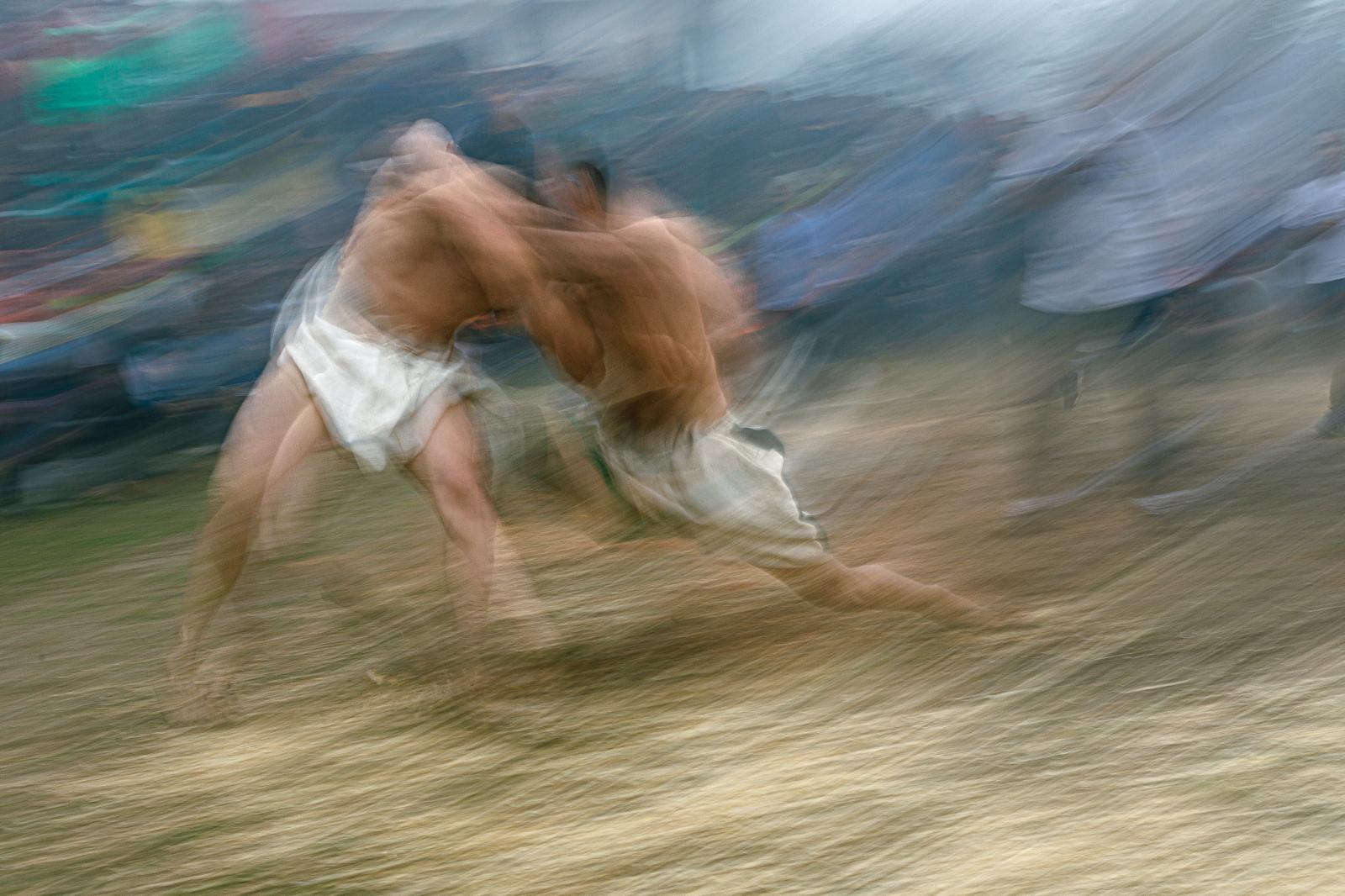  Dancing in the wind Two wrestl... use a white stretch swimsuit. 