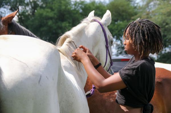 Chicago's Black Cowboys - Jhorden braids her horse