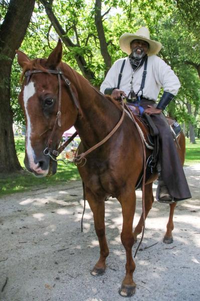 Chicago's Black Cowboys - Jerry and his horse Rocky the Rocking Horse ride around the park before the group ride. Jerry has...
