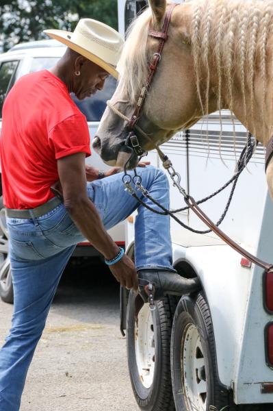 Chicago's Black Cowboys - Greg puts on his boots and spurs in preparation for the 33rd annual group ride. Historically, in...