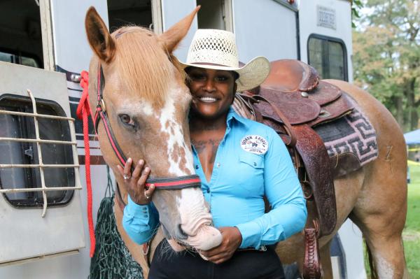 Chicago's Black Cowboys - Stoney poses with her horse Herbert before participating in the 33rd annual High Noon Ride on...
