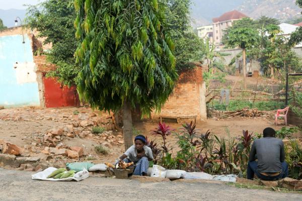 Bujumbura - City in the Heart of Africa - A woman sells corn on the curb in the Gihosha neighborhood. 90% of the people depend on...