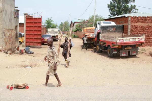 Bujumbura - City in the Heart of Africa - A child plays with a makeshift toy car in the Kanyosha neighborhood of Bujumbura.  Bujumbura Burundi