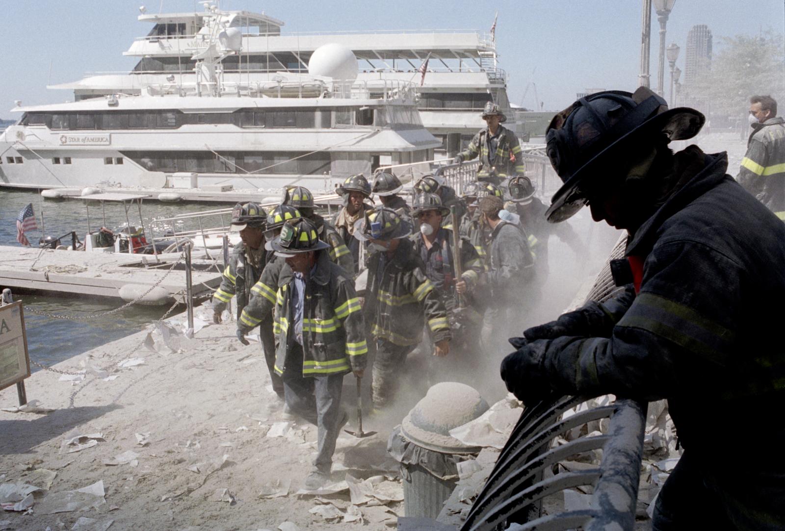 FDNY firefighters carry fellow ...Trade Center on Sept. 11, 2001.
