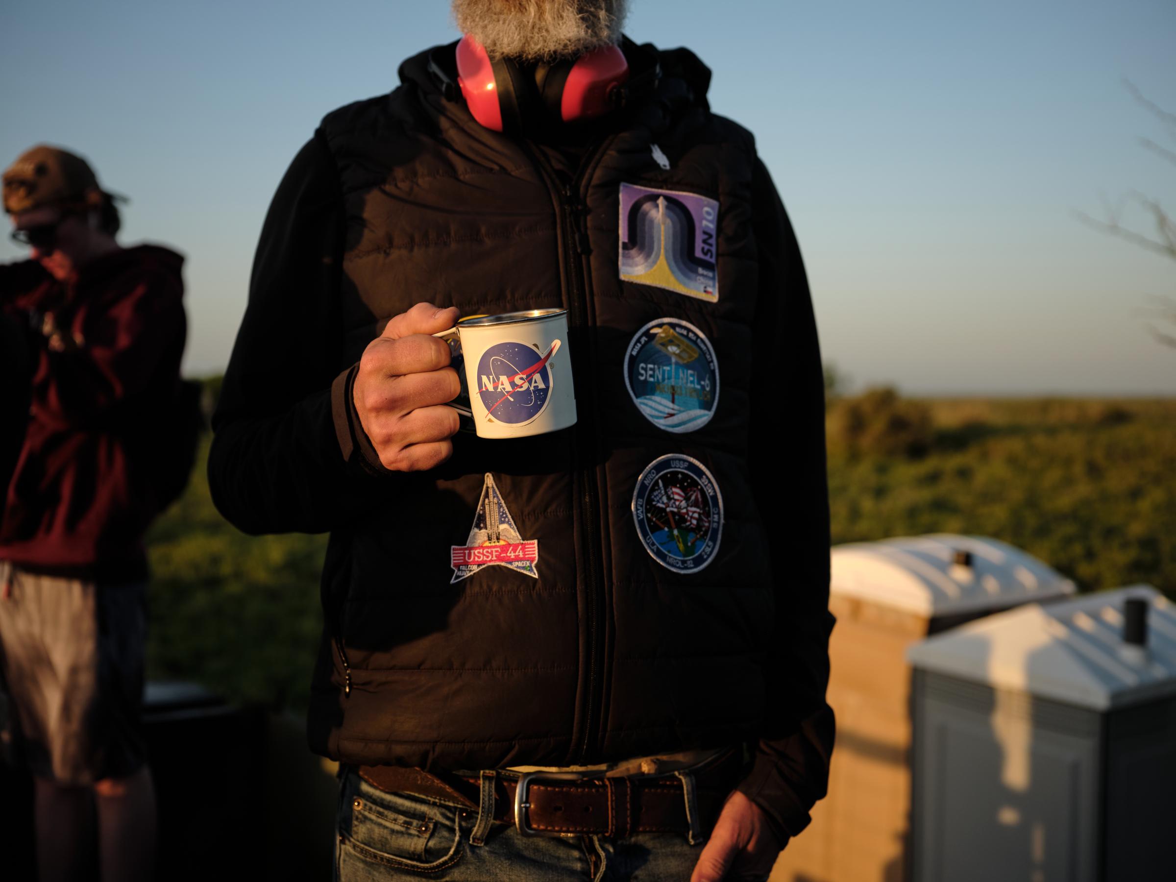 Rocket Ranch - A man drinks a cup of coffee in the early morning of...
