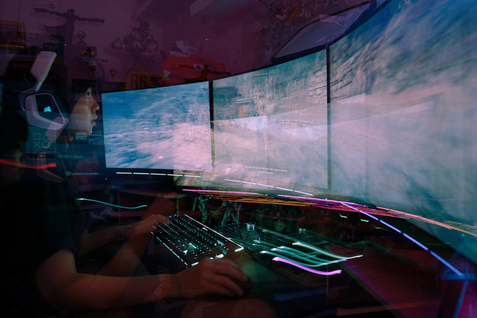 Virtual Insanity: Inside The Life of Pro-Gamers - A sophisticated computer with a curved screen to practice in her private game studio. She is...
