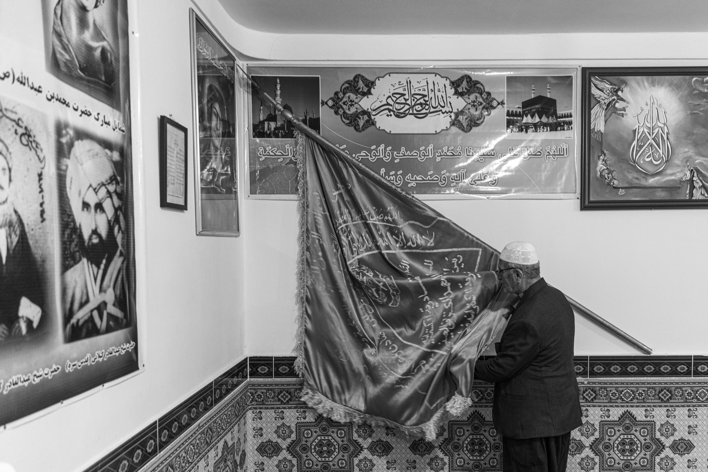Tariq Qadiriya - After entering the monastery, every disciple kisses this flag, which they believe is blessed.