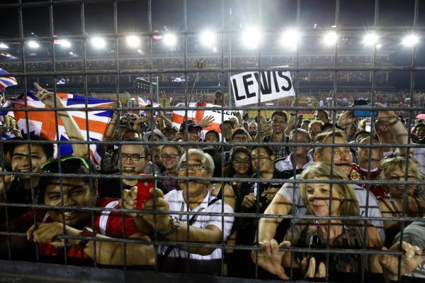 Image from Sports - Formula One fans cheer after F1 driver Lewis Hamilton of...